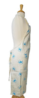 Tropical blue crab design full length adjustable apron in cream side view