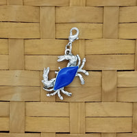 Crab jewelry charm with blue enameled shell and lobster claw clasp
