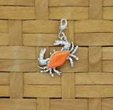 Crab jewelry charm with orange enameled shell and lobster claw clasp
