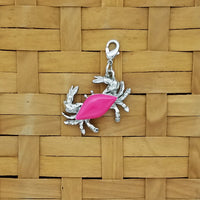 Crab jewelry charm with pink enameled shell and lobster claw clasp